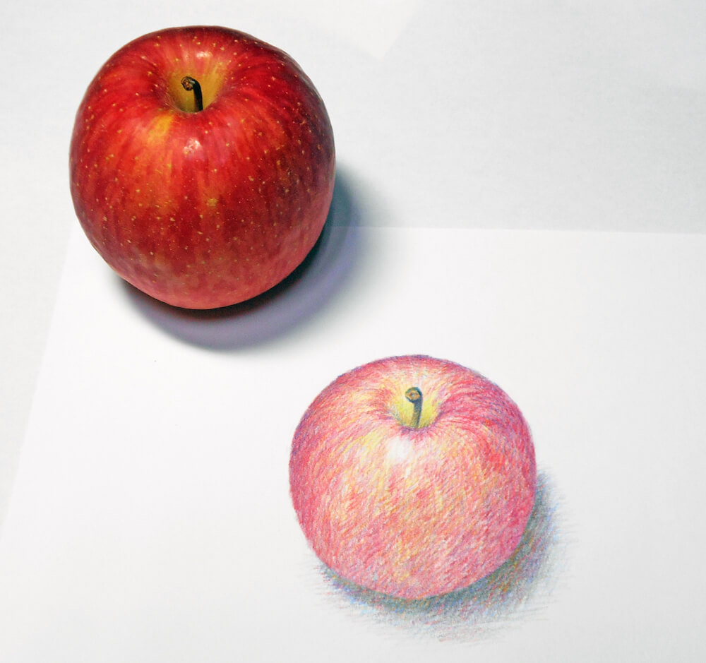 りんごをデッサンしたイメージ写真
