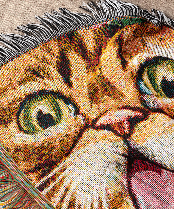ジャガード織りで立体的に見える猫デザインのスローケット